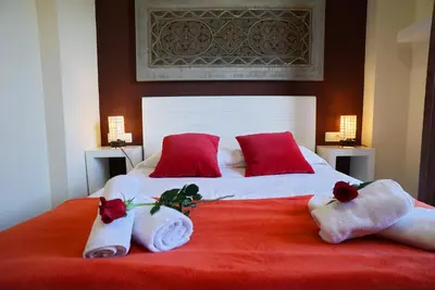 a bedroom with a large bed with towels on it at Barcelona4Seasons - Central Palace in Barcelona