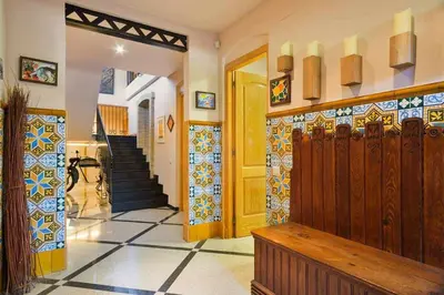 a hallway with a door and a tile floor at Xalet de la Muntanya, El Bruc-Montserrat in El Bruc