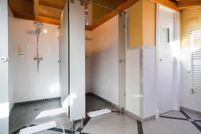a bathroom with a shower and a glass door at Xalet de la Muntanya, El Bruc-Montserrat in El Bruc