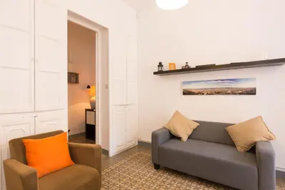 a living room with a couch and two chairs at ApartEasy - Central Gracia Apartments in Barcelona