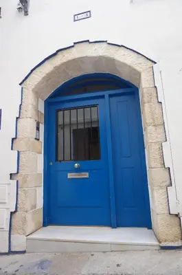 a blue door in a brick archway at Love Sitges & Beach in Sitges