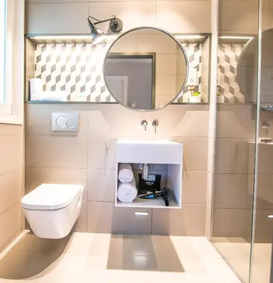 a bathroom with a toilet and a mirror at Mosaic by Ona in Barcelona