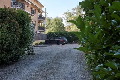a car parked in a driveway next to a building at Rincón de piedra BCN in Corró de Vall