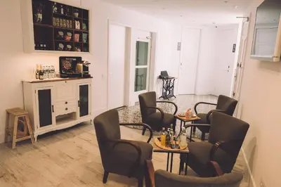 a dining room with chairs and a table and a table and chairsktop at Hotelet Casa Padró in Manresa