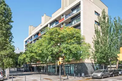 a tall building with a traffic light in front of it at Jie Apartment in Sant Adria de Besos