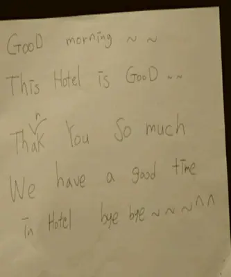 a handwritten note with handwriting on a whiteboard at Hostal Absolut Stay in Barcelona