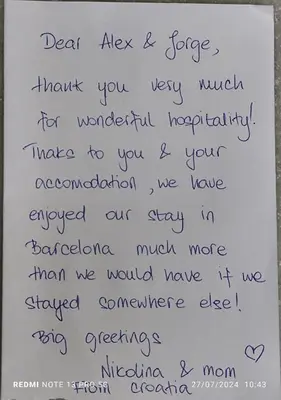 a handwritten letter on a white piece of paper at Hostal Absolut Stay in Barcelona