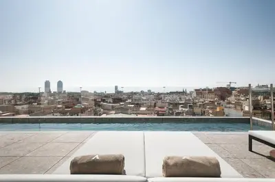 a view of the city from the roof of a building at Yurbban Passage Hotel & Spa in Barcelona