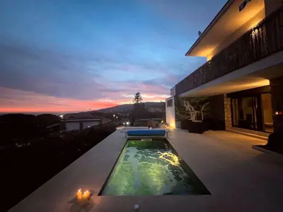 a swimming pool on the side of a house at Apartment Pearl of Cabrils in Cabrils