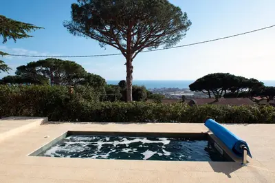 a pool of water with a blue tube in it at Apartment Pearl of Cabrils in Cabrils