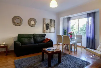 a living room with a couch and a table at Valencia Suite ArchsenseApartments in Barcelona