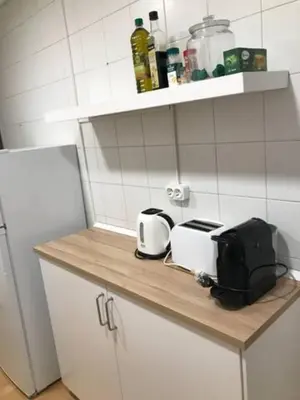 a kitchen counter with two toasters and a toaster at Centric Apartments Paseo de Gracia in Barcelona