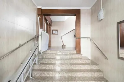 a hallway with stairs in a building at Apartment Leonor in Barcelona
