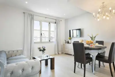 a living room with a couch and a dining room table at Apartment Leonor in Barcelona