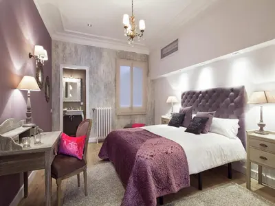 a bedroom with a large bed and a desk at Exclusive apartment for 4 people in characteristic area of Barcelona in Barcelona