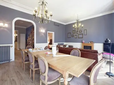 a dining room with a table and a couch at Exclusive apartment for 4 people in characteristic area of Barcelona in Barcelona