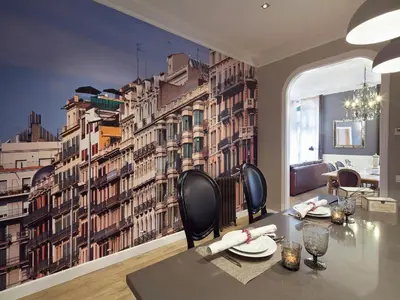 a dining room with a wall mural of buildings at Exclusive apartment for 4 people in characteristic area of Barcelona in Barcelona