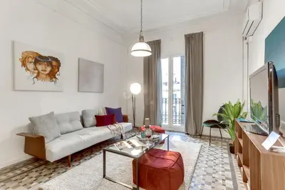 a living room with a couch and a table at Sweett - Aragon in Barcelona