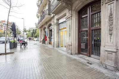 an empty street in a city with buildings at Sweett - Aragon in Barcelona