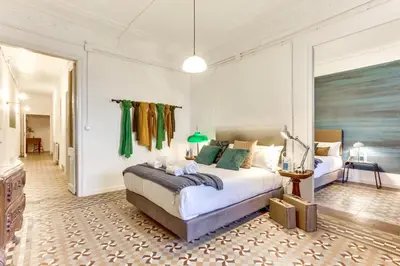 a bedroom with a large bed in a room at Sweett - Aragon in Barcelona