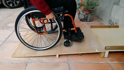 a person in a wheelchair sitting on a ramp at Can Parròquia in Sant Esteve de Palautordera