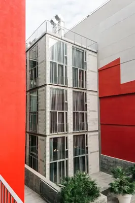 a building with a red and white building at Barcelona Apartment Republica in Barcelona