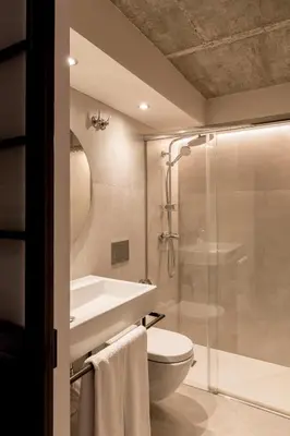 a bathroom with a shower and a toilet and a sink at Barcelona Apartment Republica in Barcelona