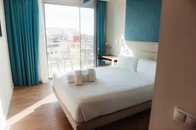 a bedroom with a bed with two towels on it at Arya Stadium Hotel in Barcelona