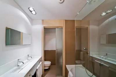 a bathroom with a shower and a sink and a toilet at Hotel Actual in Barcelona