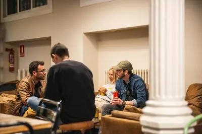 a group of people sitting on couches in a room at Safestay Barcelona Gothic in Barcelona