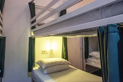 a small room with two bunk beds in it at Safestay Barcelona Gothic in Barcelona