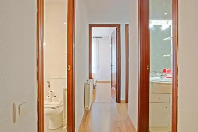 a bathroom with a toilet and a sink at Alcam El Coll in Barcelona