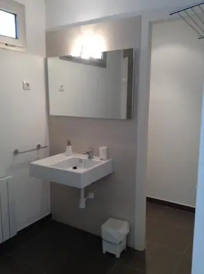 a bathroom with a sink and a mirror at Masia Vista Hermosa in Vallromanas