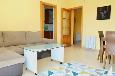 a living room with a couch and a table at Apartment Port Forum in Barcelona