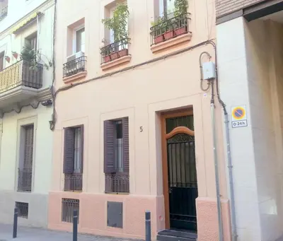 a building on the corner of a street at NEW! Cute apartment near metro in Barcelona