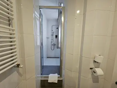 a bathroom with a shower with a glass door at Hotel Palermo in Barcelona