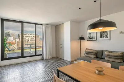 a living room with a couch and a table at Aspasios Poble Nou Apartments in Barcelona