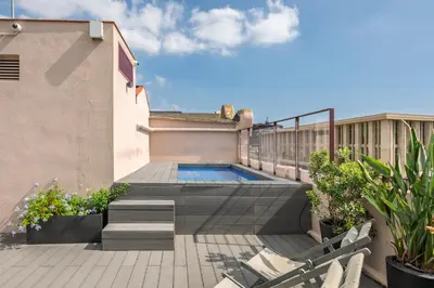 a balcony with a plunge pool on a house at Aspasios Poble Nou Apartments in Barcelona