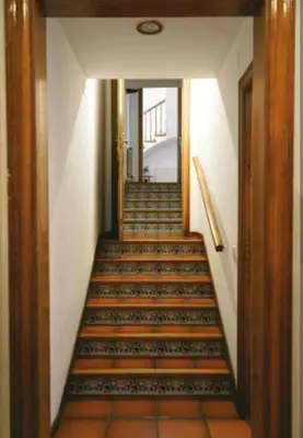 a hallway with a staircase in a building at Les Canyes Cottage, Private Villa Resort in Piera