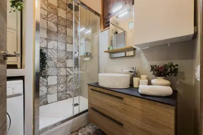 a bathroom with a sink and a shower at Magalhaes · Trad flat in Poble Sec, near ramblas in Barcelona