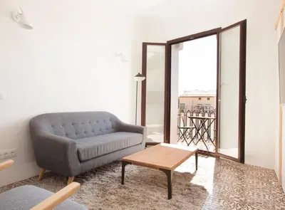 a living room with a couch and a coffee table at Pere IV · New & modern apartment close to beach in Barcelona