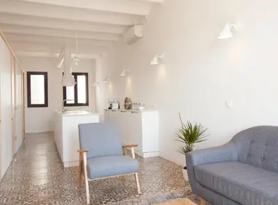 a living room with a couch and a chair at Pere IV · New & modern apartment close to beach in Barcelona