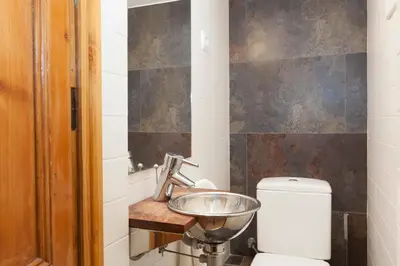 a bathroom with a sink and a toilet at Akira Flats Roger de Flor Chic apartment in Barcelona