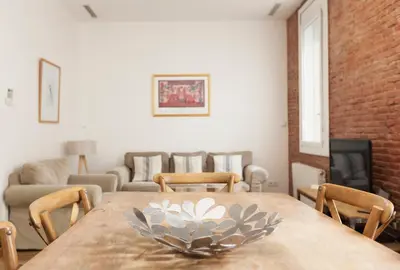 a dining room with a table with a bowl on it at Akira Flats Roger de Flor Chic apartment in Barcelona