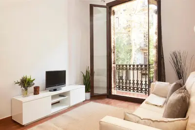 a living room with a tv and a couch at EasySleep Gaudi Terrace in Barcelona