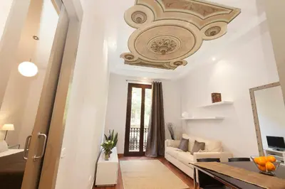 a living room with a couch and a ceiling at EasySleep Gaudi Terrace in Barcelona
