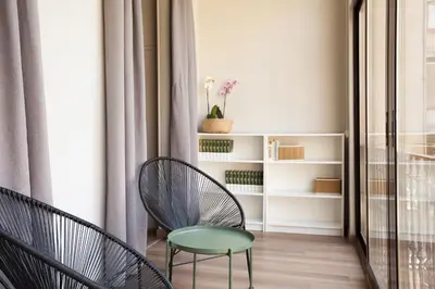 a room with two chairs and a table at EasySleep Gaudi Terrace in Barcelona