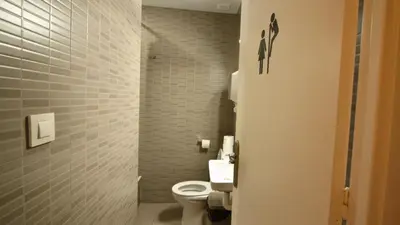 a bathroom with a white toilet in a room at Paraiso Hostel in Barcelona