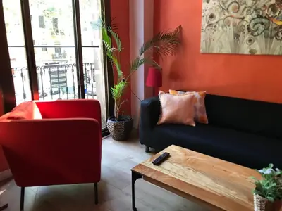 a living room with a couch and a coffee table at Paraiso Hostel in Barcelona