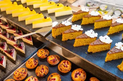 a buffet of food with different types of desserts at Hotel Mar Blau in Calella